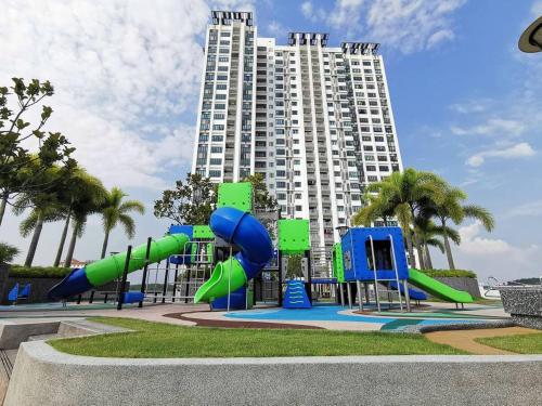 a playground in front of a large building at Bukit Indah 12pax Aeon Lego Wi-fi Netflix BySTAY in Johor Bahru