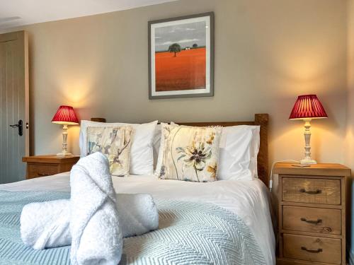 Ένα ή περισσότερα κρεβάτια σε δωμάτιο στο Jasmine Cottage