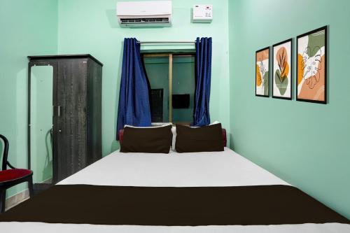 Postel nebo postele na pokoji v ubytování Super Hotel O Juran Chapra Muzaffarpur Formerly Ramco Residential