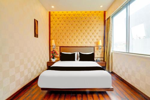 Ένα ή περισσότερα κρεβάτια σε δωμάτιο στο Palette Hotel and Resort Zero Mile Sitabuldi Formerly Gangakashi