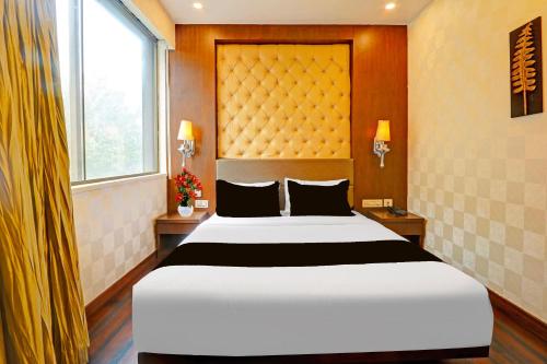 Ένα ή περισσότερα κρεβάτια σε δωμάτιο στο Palette Hotel and Resort Zero Mile Sitabuldi Formerly Gangakashi