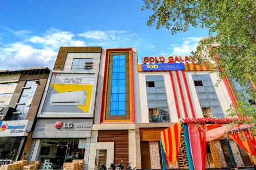 a building with a god family job corps sign on it at FabHotel Gold Galaxy in Kānpur