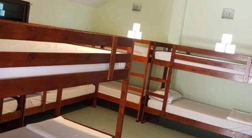 a couple of bunk beds in a room at Hat yao Seaview Beach Room in Trang