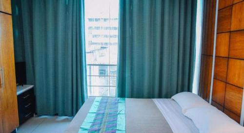 Postel nebo postele na pokoji v ubytování Marcian Business Hotel
