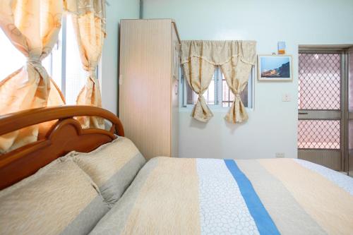 Chuan Ya Ju Homestayにあるベッド