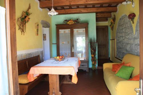 a living room with a table and a couch at Agriturismo Biagiotti in Abbadia San Salvatore