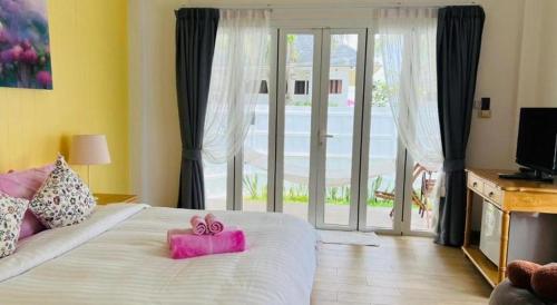 Postel nebo postele na pokoji v ubytování Sea Coco Resort