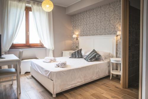 Un pat sau paturi într-o cameră la La Dimora di Francesco