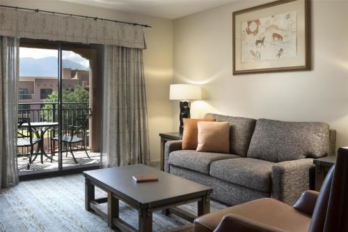 a living room with a couch and a table at Hyatt Regency Tamaya South Santa Fe in Santa Ana Pueblo