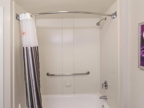 a shower with a shower curtain in a bathroom at La Quinta by Wyndham Denver Englewood Tech Ctr in Greenwood Village