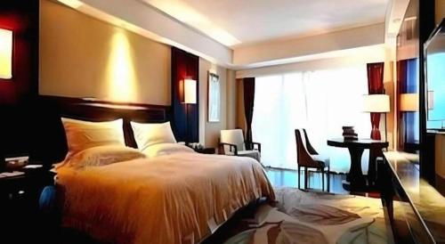 Postel nebo postele na pokoji v ubytování Man Wan Harmona Resort