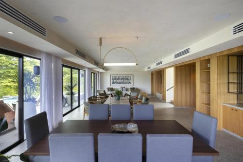 a dining room with a table and chairs at Waldorf Astoria Costa Rica Punta Cacique in Playa Hermosa