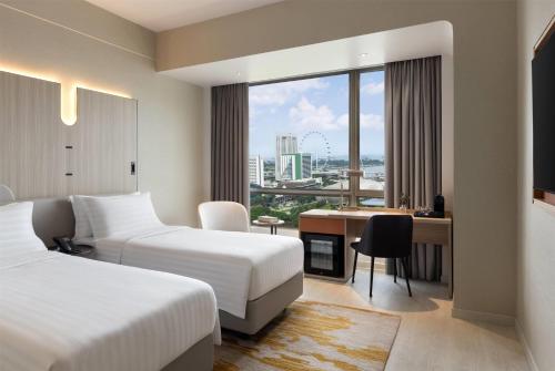 En eller flere senge i et værelse på Wyndham Singapore Hotel