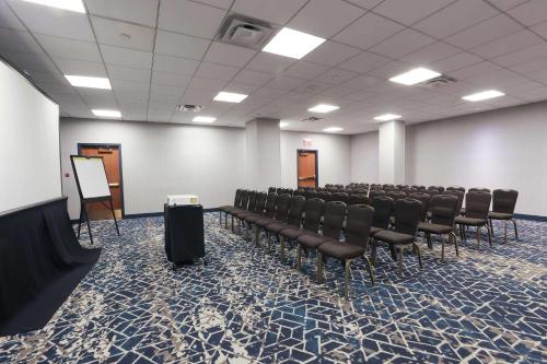 a conference room with chairs and a podium in it at Radisson Plaza Hotel at Kalamazoo Center in Kalamazoo