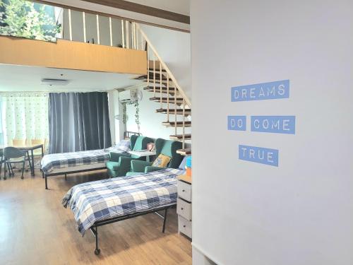 a room with a bunk bed and a staircase at Like U Residence in Goyang