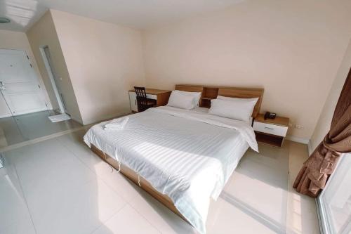 Ένα ή περισσότερα κρεβάτια σε δωμάτιο στο The Grow Hotel & Residence