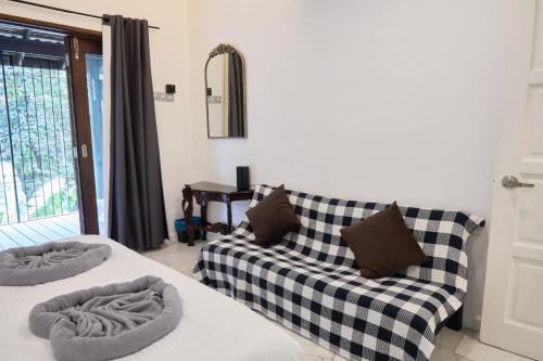 a living room with two couches and a couch at LilyJoe Treehouse Serendah in Serendah