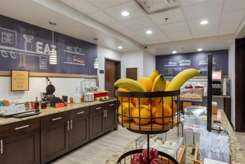 a basket of bananas and other fruit in a store at Hampton Inn Mesa Verde/Cortez Co in Cortez