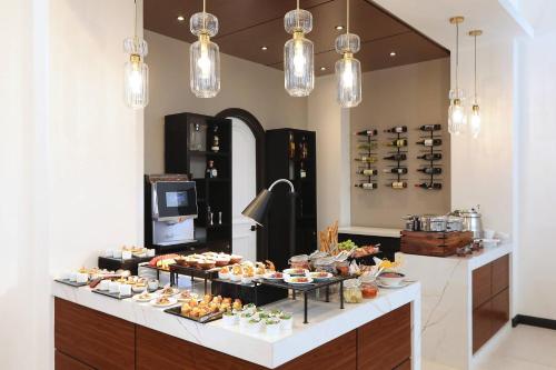a buffet line with appetizers and desserts on display at Clarion Hotel Real Tegucigalpa in Tegucigalpa