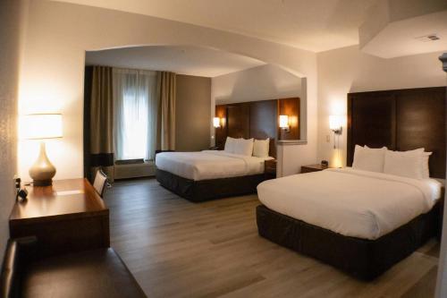 a hotel room with two beds and two lamps at Comfort Suites Salisbury I-85 in Salisbury