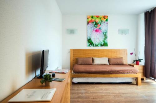 Coin salon dans l'établissement Comfort Aparthotel Mutzig Portes d'Alsace