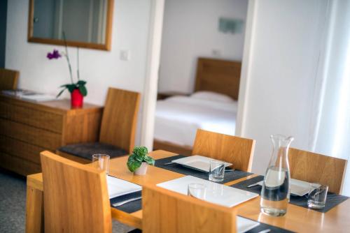 Un ou plusieurs lits dans un hébergement de l'établissement Comfort Aparthotel Mutzig Portes d'Alsace