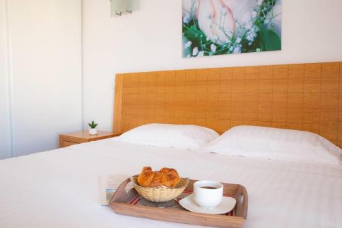 Un ou plusieurs lits dans un hébergement de l'établissement Comfort Aparthotel Mutzig Portes d'Alsace