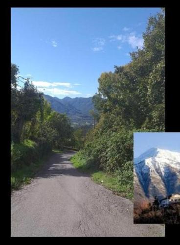 a dirt road with a view of a mountain at Il Borgo del Ghiro in Irola