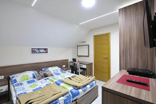 a hospital room with a bed and a desk at Vila Mina in Zlatibor
