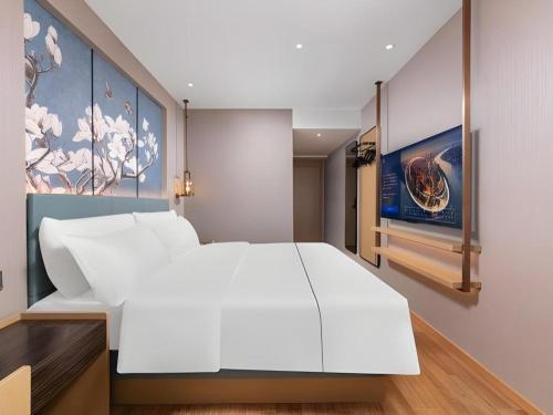 Ένα ή περισσότερα κρεβάτια σε δωμάτιο στο Magnotel Classic Shenyang General Hospital of Northern Theater Command