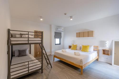 a bedroom with a bunk bed and a bunk bedouble at Studio 365 Serviced Apartments in Chiang Mai