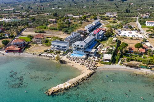 an aerial view of a resort on the beach at Amaltheia Beachfront Villas in Kipseli