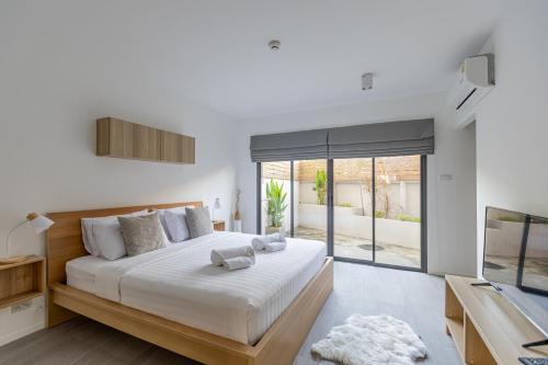 Cama o camas de una habitación en Studio 365 Serviced Apartments