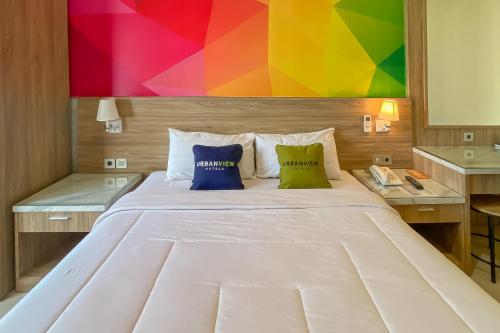 Katil atau katil-katil dalam bilik di Urbanview Anelia Guest House Syariah Samarinda