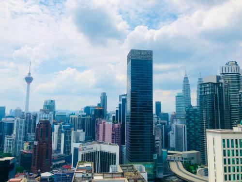 a view of a large city with tall buildings at Axon Residence Pavilion Bukit Bintang SkyView in Kuala Lumpur
