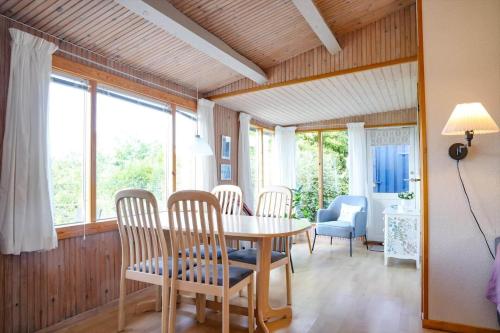 a dining room with a table and chairs at 16608-1-Farevejle-Horager-8 in Kårup