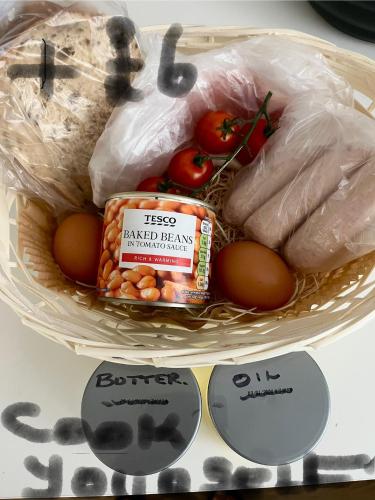 a basket of food with eggs and chicken and tomatoes at Hellfire corner in Redruth