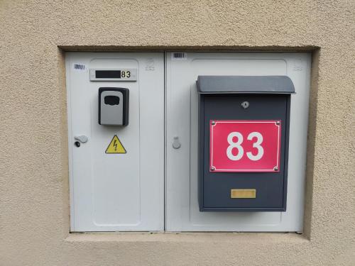 a building with a door with a sign on it at Apartmány Opolany in Opolany