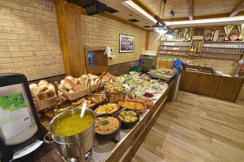 a buffet line with many different types of food at Vila Mina in Zlatibor
