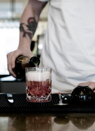 a bottle of wine being poured into a glass at Hotel SP34 in Copenhagen