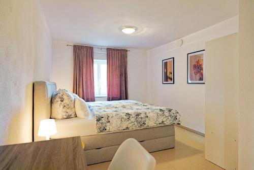 Postel nebo postele na pokoji v ubytování Denkmal-Wohnung in Bamberg