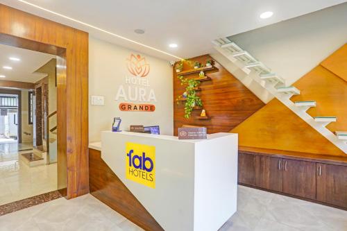 a fico store with a staircase in a building at FabHotel Aura Grande in Indore