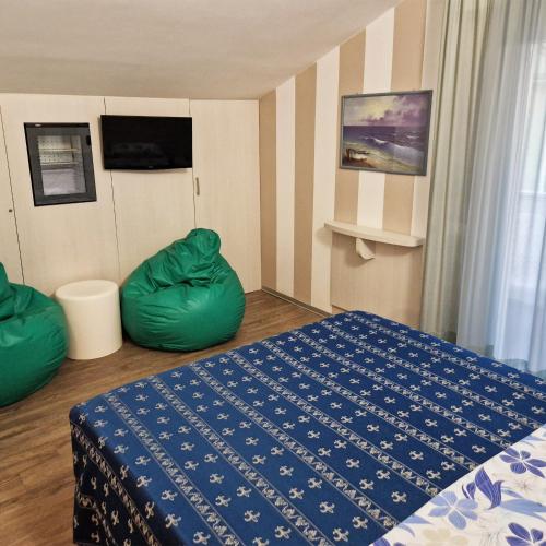 Ένα ή περισσότερα κρεβάτια σε δωμάτιο στο Hotel Sorriso - molto più di una stella