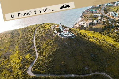 an aerial view of a small island with the ocean at La MAISON BLANCHE - Ch1B - CENTRAL - CALME - WIFI - White Butterfly Hostel in Dakar