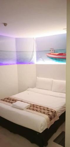 Кровать или кровати в номере Waterfront Homestay