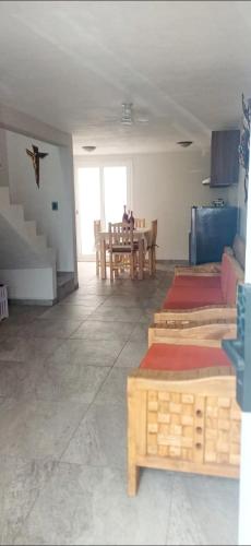 a living room with a table and a dining room at Casa del Sol in Toluca