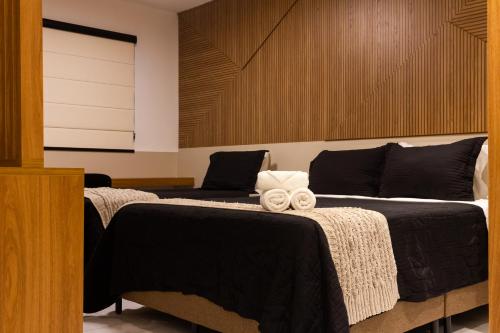 Ένα ή περισσότερα κρεβάτια σε δωμάτιο στο Loft Super Aconchegante