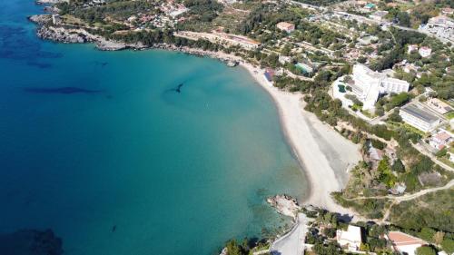 an aerial view of a beach and the ocean at Hotel Calanca in Marina di Camerota