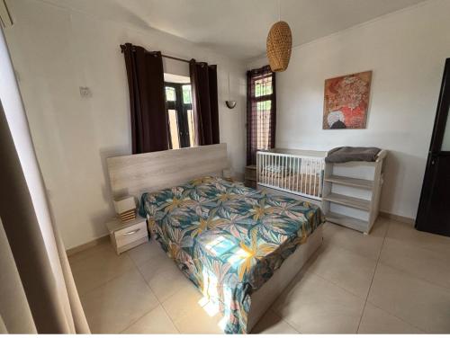 Katil atau katil-katil dalam bilik di Maharana Grand Baie villa