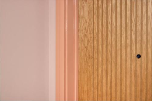 a close up of a wooden door in a room at Turing Locke Cambridge in Cambridge